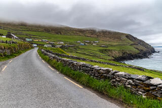 Atlantic shoreline road leads to village