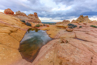 Refection of Clouds in Water Pocket