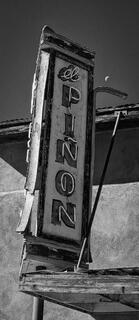 El Pinon theatre sign with moon in distance
