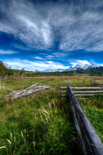 Fenceline Points to Mountains