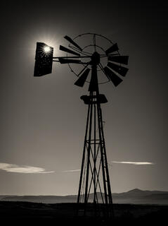 Starburst thru bullet holes on windmill
